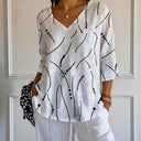 Van Elst Mode® | Blouse met speels lijnenspel en luchtige pasvorm